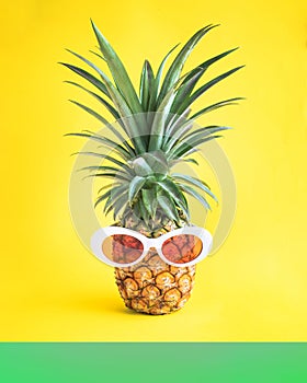 Summer holiday concepts with pineapple and sunglasses in pastel