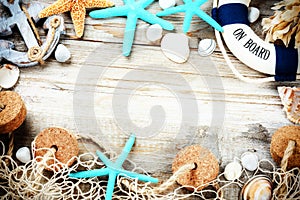 Summer holiday frame with seashells and beach accessories