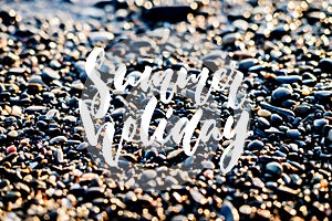 Summer holiday - hand drawn positive holiday lettering phrase on the beach sea or ocean background. Fun brush ink quote