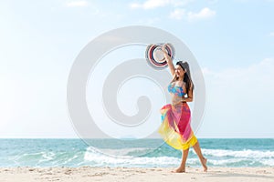 Summer Holiday. Lifestyle woman chill holding big white hat and wearing bikini fashion summer trips