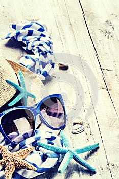 Summer holiday setting with straw hat and sunglasses