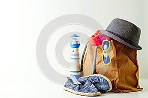 Summer holiday travel concept.Hipster Beach bag with items for a