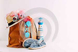 Summer holiday travel concept.Hipster Beach bag with items for a