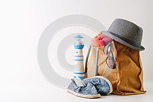 Summer holiday travel concept.Hipster Beach bag with items for a