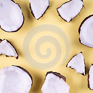 Summer holiday tropical flat lay mockup background. cocnut piece slice yellow on yellow