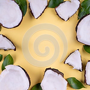 Summer holiday tropical flat lay mockup background. green leaves, cocnut piece slice yellow on yellow