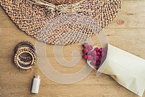 Summer holiday, vacation, relaxation concept. Raspberries, straw