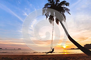 Summer holidays, happy woman on the swing on tropical beach , vacation