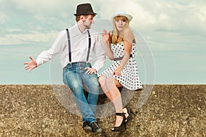 Loving couple retro style dating on sea coast