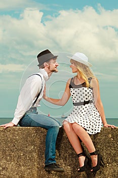 Loving couple retro style dating on sea coast