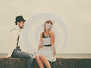 Loving couple retro style dating on sea coast