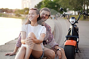 Summer holidays, love, travel, tourism, relationship and dating concept - romantic happy couple hugging in the street.