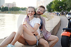 Summer holidays, love, travel, tourism, relationship and dating concept - romantic happy couple hugging in the street.