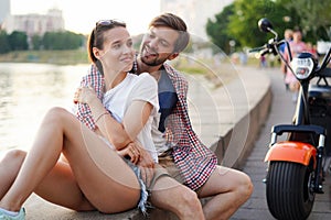 Summer holidays, love, travel, tourism, relationship and dating concept - romantic happy couple hugging in the street.