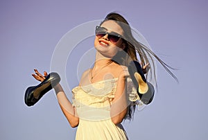 Summer holidays. Model tender summer dress. Freedom. Girl in sunglasses copy space. Towards summer. Afterparty concept