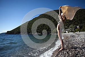 Summer holidays, vacation and beach concept - girl in bikini and shades on the beach