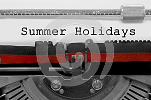 Summer Holydays text on white sheet in vintage typewriter