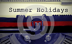 Summer Holydays text on white sheet in vintage typewriter