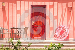 Summer house coral porch with inflatable donut tube