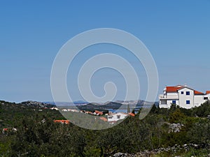 Summer houses and apartments in Murter