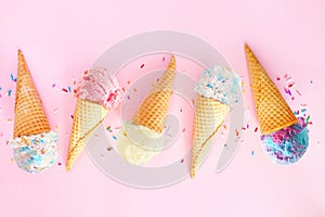 Summer ice cream cone flat lay over a pink background