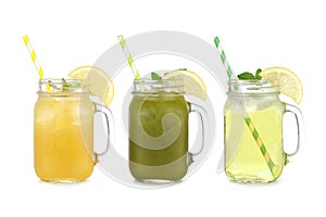 Summer iced green teas in mason jar glasses isolated on white