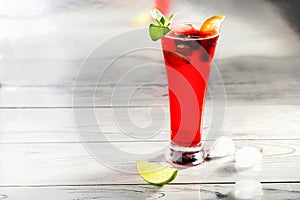 Summer iced refreshment drink, cherry lemonade on table