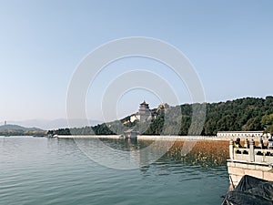 Summer Imperial Palace on the shore with a blue sky in the background, in Beijing, China