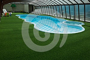 Summer indoor pool with blue water