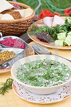 Summer kvass soup (okroshka) on served table