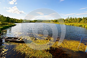 The summer lake and boat