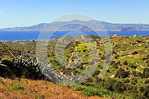 Summer landscape with aegean sea, green hills and meadows