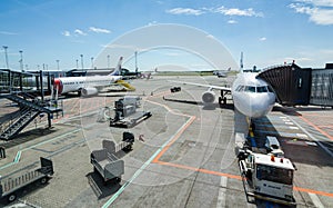 Summer landscape of airfield area with awaiting airplaines