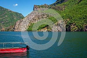 Summer landscape Ã¢â¬âAlbanian mountains, lake and old red boat