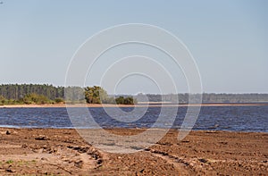 Summer landscape on the banks of the river water sand and clear sky in the city of federation province of entre rios argentina