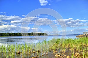 Summer landscape blue sky clouds river in Sweden photo