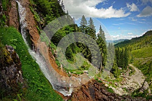 Summer landscape with Cascada Cailor (Horses Waterfall) in Rodnei Mountains, landmark attraction in Romania