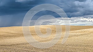 Summer landscape with dramatic thunderclouds in the background