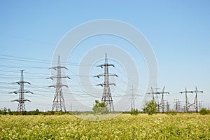 Summer landscape with electricity pylons