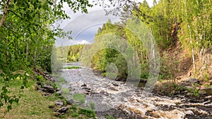 Summer landscape fast of the Ural river with the trees on the Bank of Russia, June