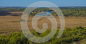 Summer landscape, field and bend of the  river