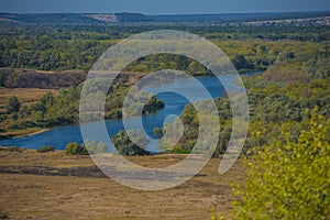 Summer landscape, field and bend of the  river