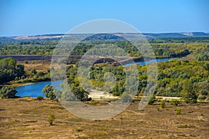 Summer landscape, field and bend of the  river