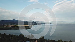 Summer landscape with fields, meadows, lake and mountains. Aerial view of Storage reservoir Zemplinska Sirava