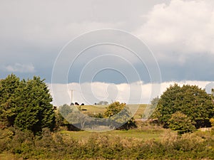 Summer landscape hills farm fields scene no people blue clouded