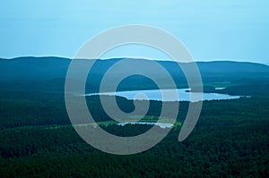 Summer landscape with lake, hills and forest