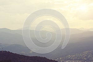 Summer landscape in mountains and the dark blue sky with clouds