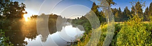 Summer landscape panorama with river and sunrise