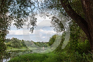 Summer landscape with river and blue sky