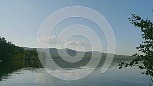 Summer landscape with river, cloudy sky, forest and sun timelapse. summer landscape with river and blue sky time lapse